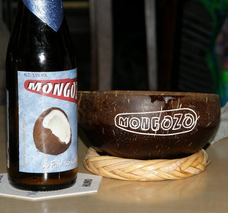 Coconut beer Mongozo in traditional cup by vikisoya