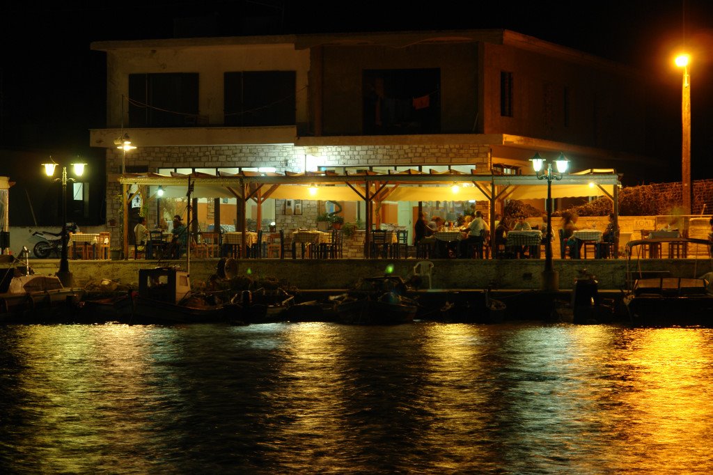 Harbor fish restaurants at night by sucramresse