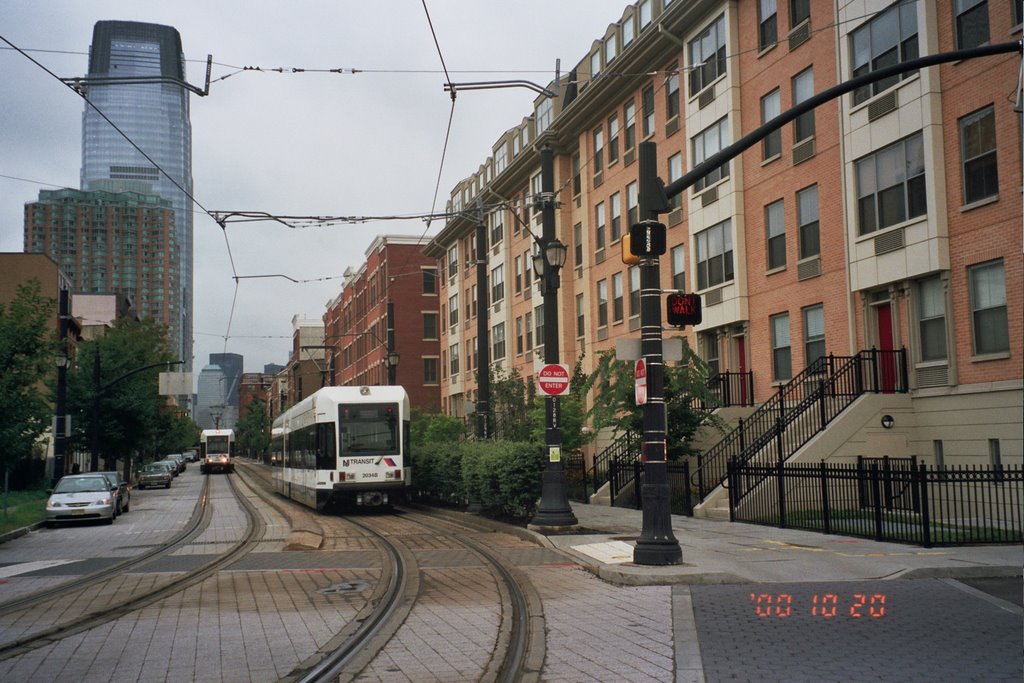 Light Rail passing new housing on Essex Street in downtown Jersey City by Miklos Pogonyi