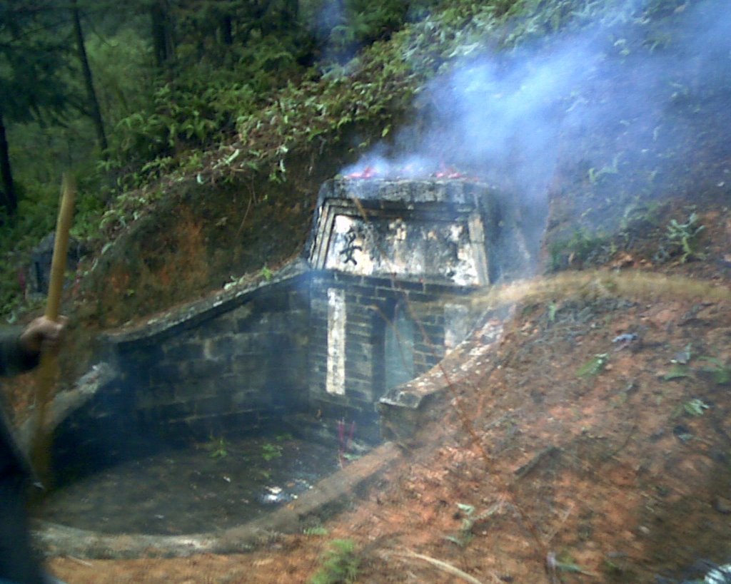 Traditional tomb in mountainous rustic area by Adam Chen