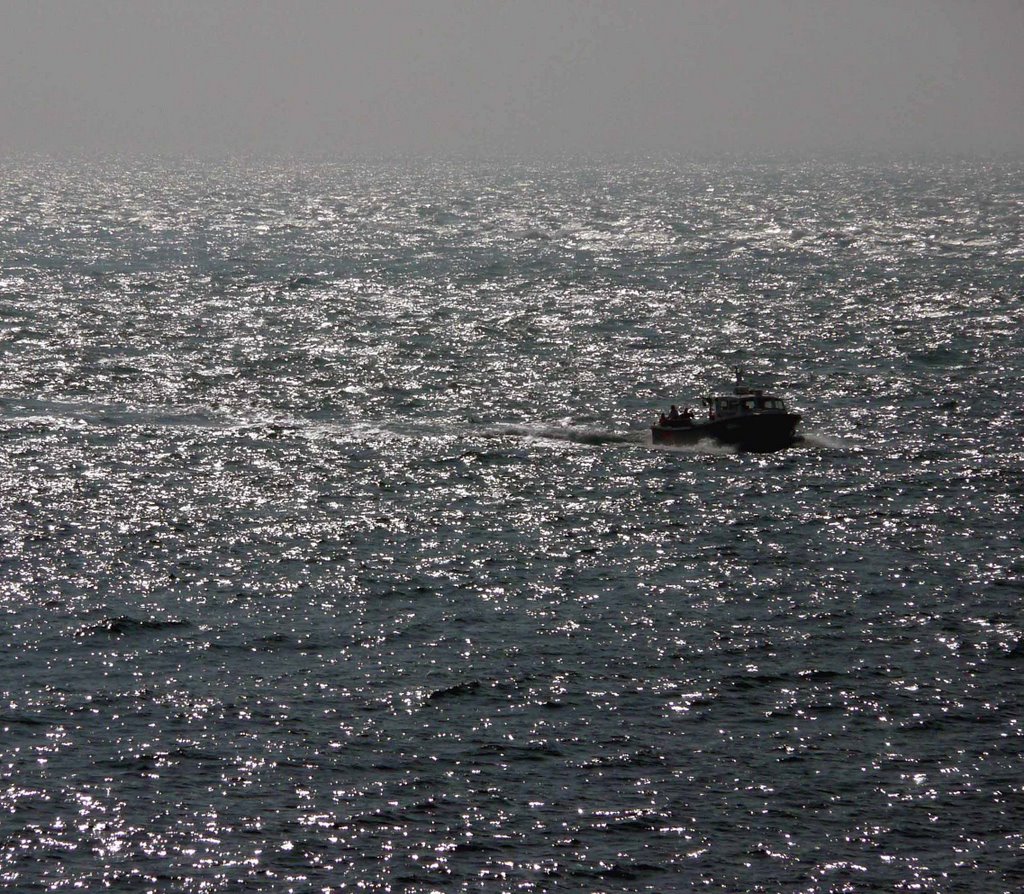 Backlit Boat off Portland Bill by Derek Wilson