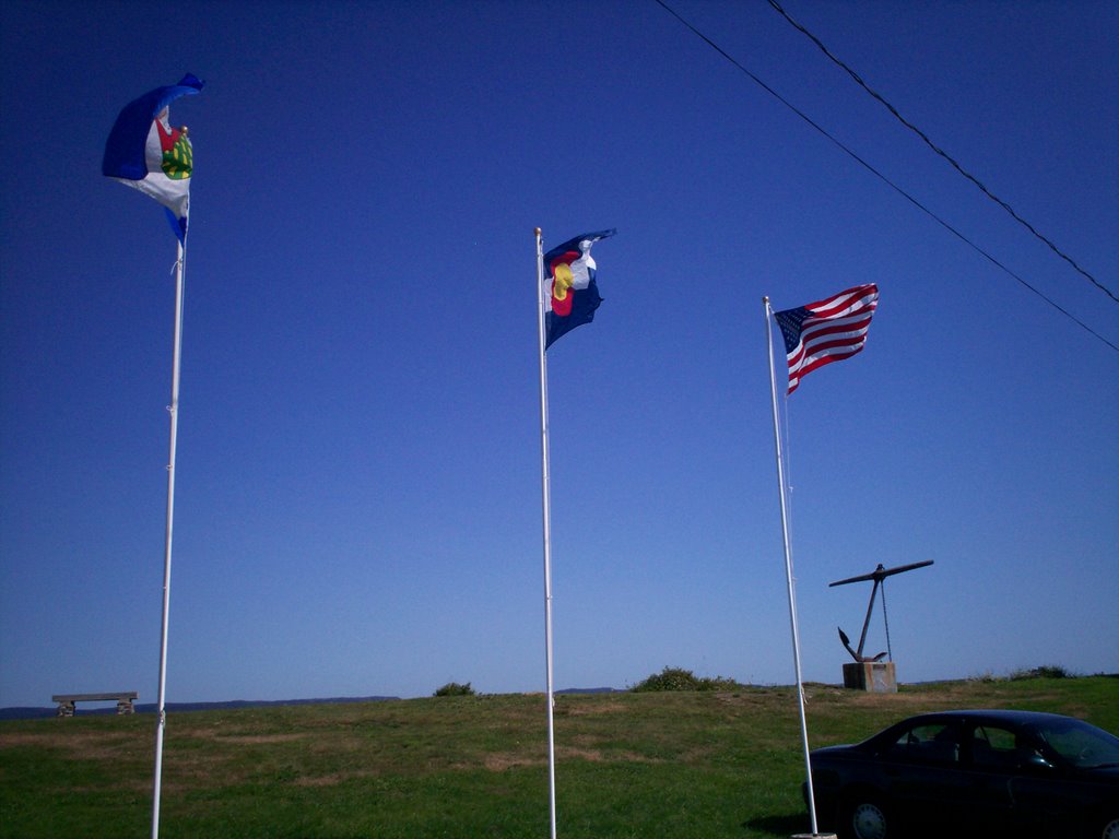 Flags flying at Gilberts Cove Lighthouse by JSchofield