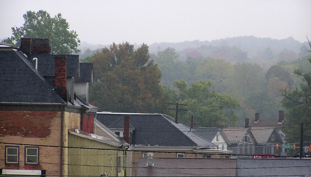 Aged roof tops under an autumnal rain by Gorestravels