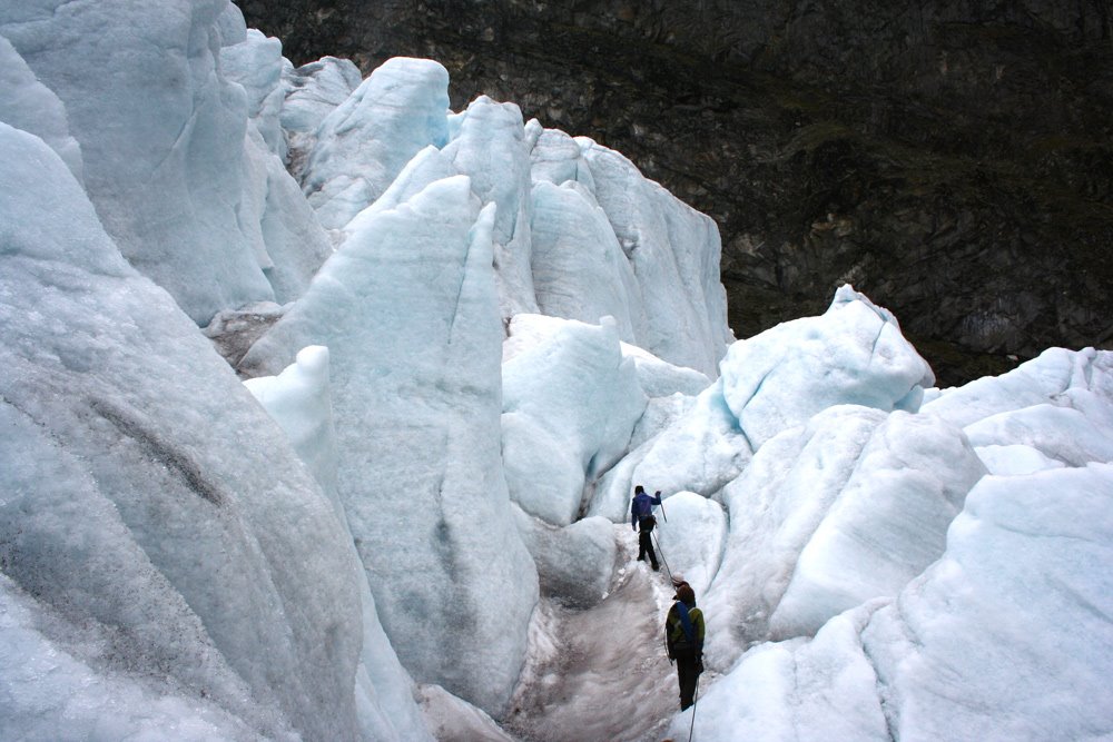 Climbers dwarfed by the surrounding Glacier by arnesbilder