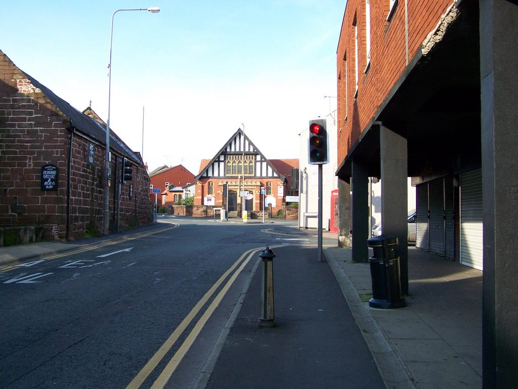 Looking Up High St Neston by Dennis Paul Griffiths