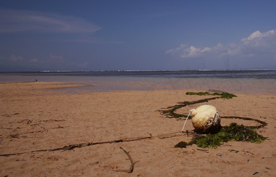 Buoy on beach by KoosKaarsgaren