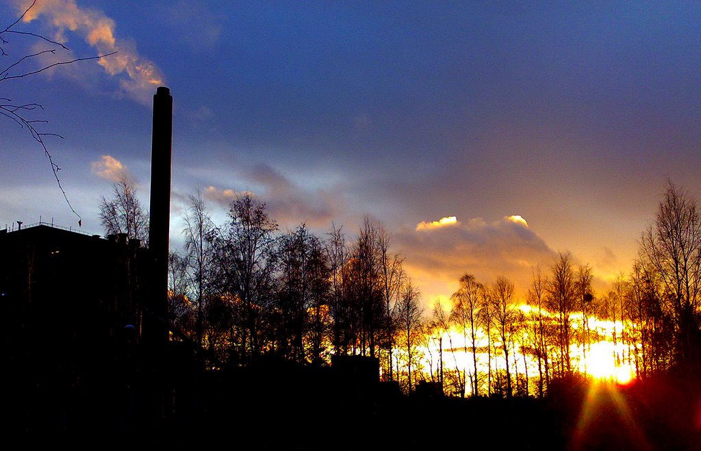 Sunset behind power plant in Toppila by Kari Pulkkinen