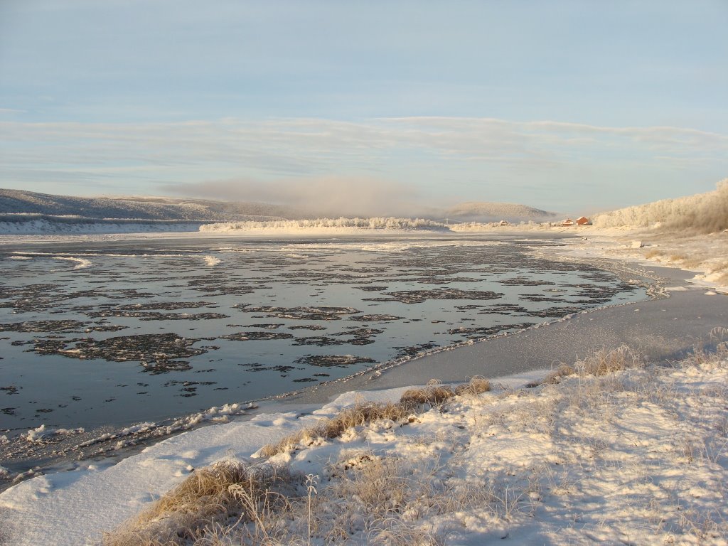 Tana river is freezing to ice by Frank M. Ingilæ