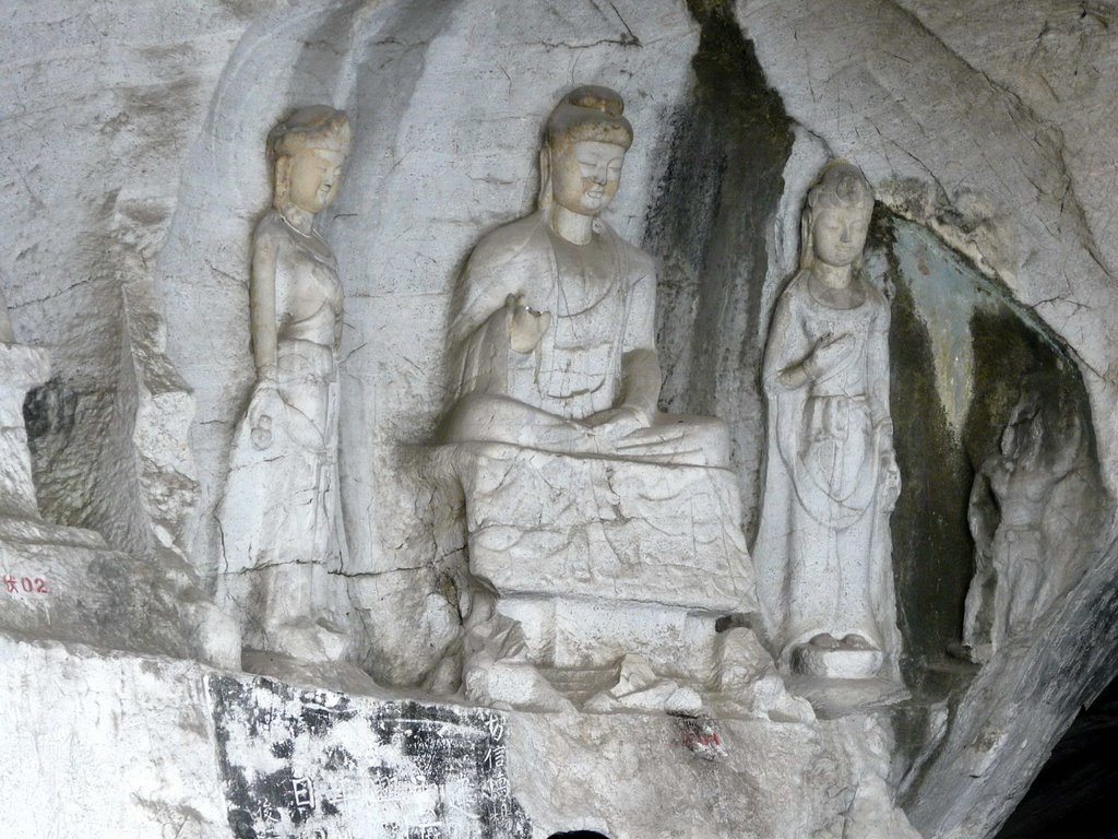 Buddha images of the Tang and Song dynasties in the Wind Cave; Diecai Garden. Guilin, China. by Nicola e Pina China