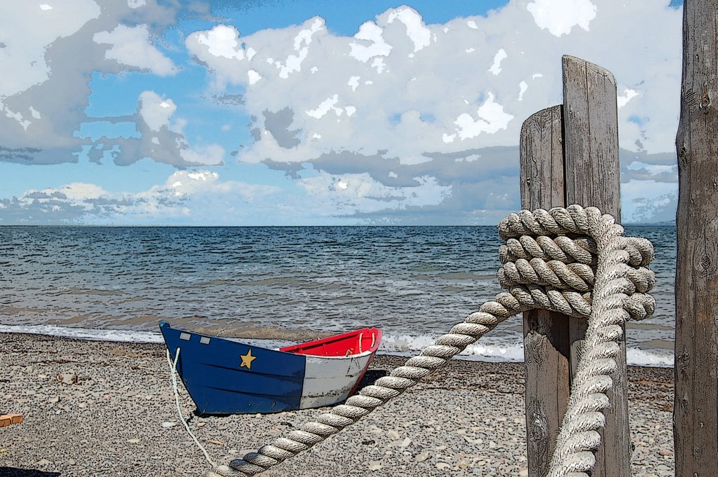 Une barque sur les galets de La Grave (Iles-de-la-Madeleine, Canada) by Dan Duquette