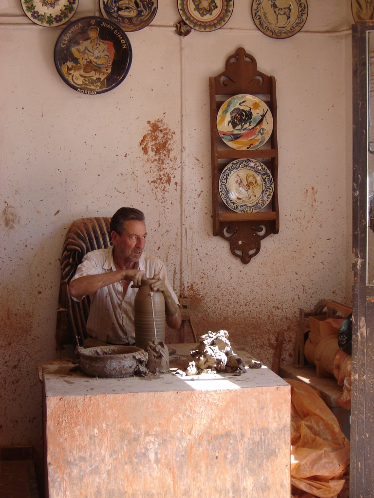 A potter at work by Robert Bovington