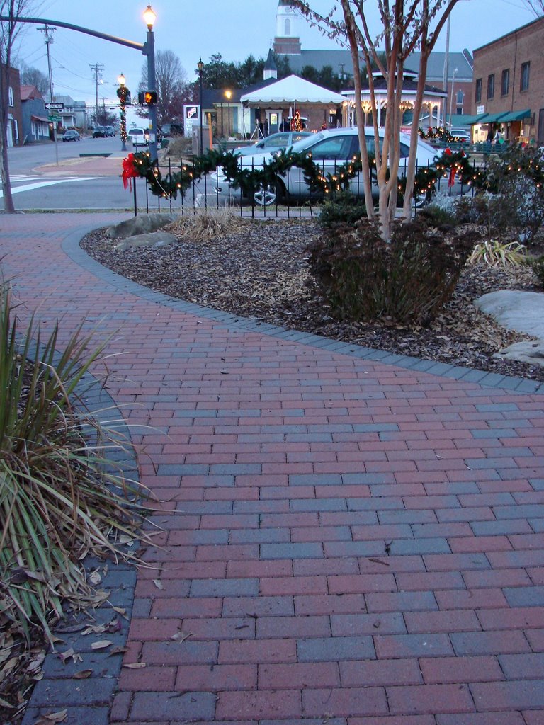 New Brick Walkway in Front of The Clock Tower and across the street you can see the tent and Gazebo getting ready for the fun tonight by Jean Gregory Evans