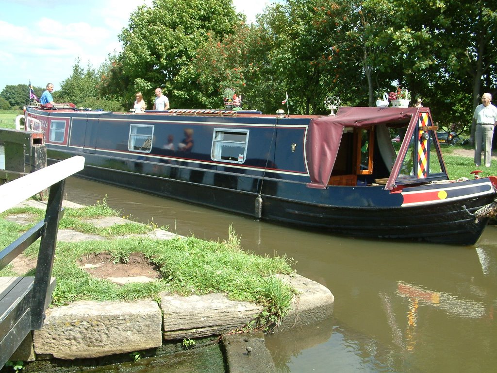 Narrowboat Leaving Lock No 2 On The Rufford Branch Of The Leeds & Liverpool Canal. by Peter Hodge