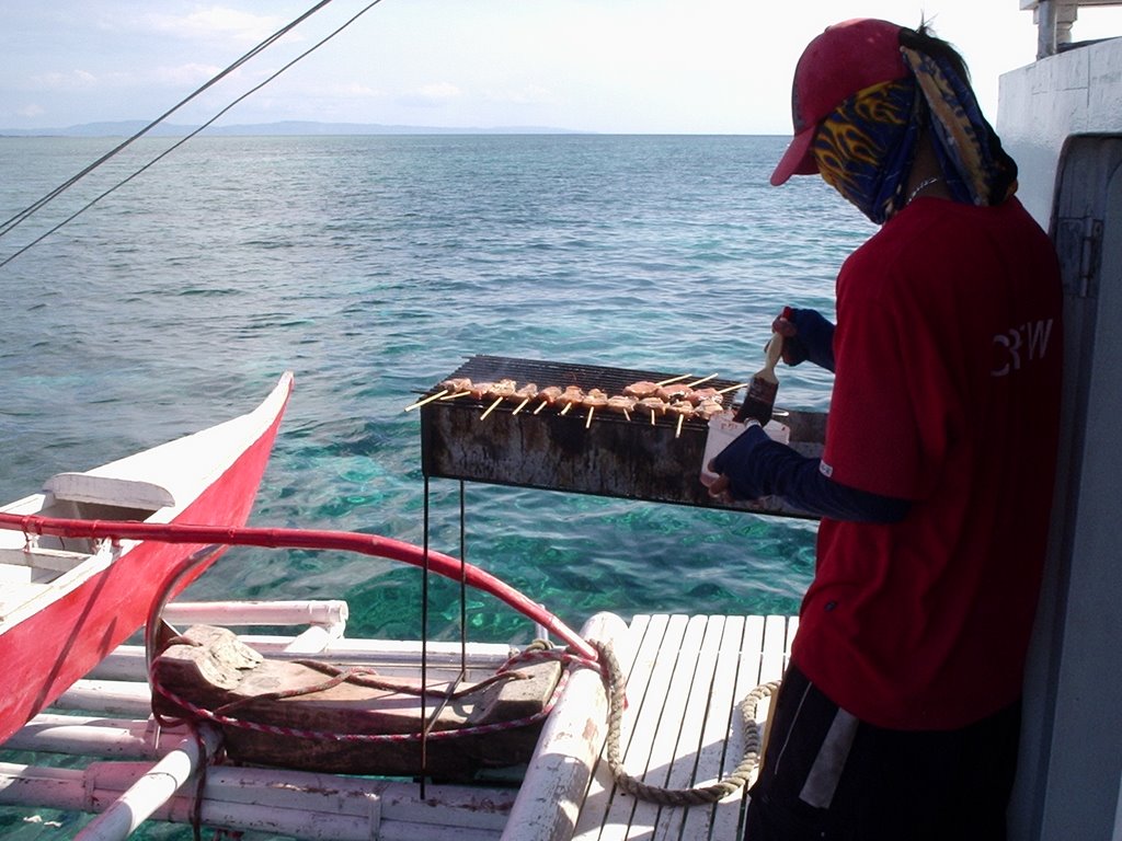 Lunch being prepared while Scuba Diving at Hilutungan Island by D Owen