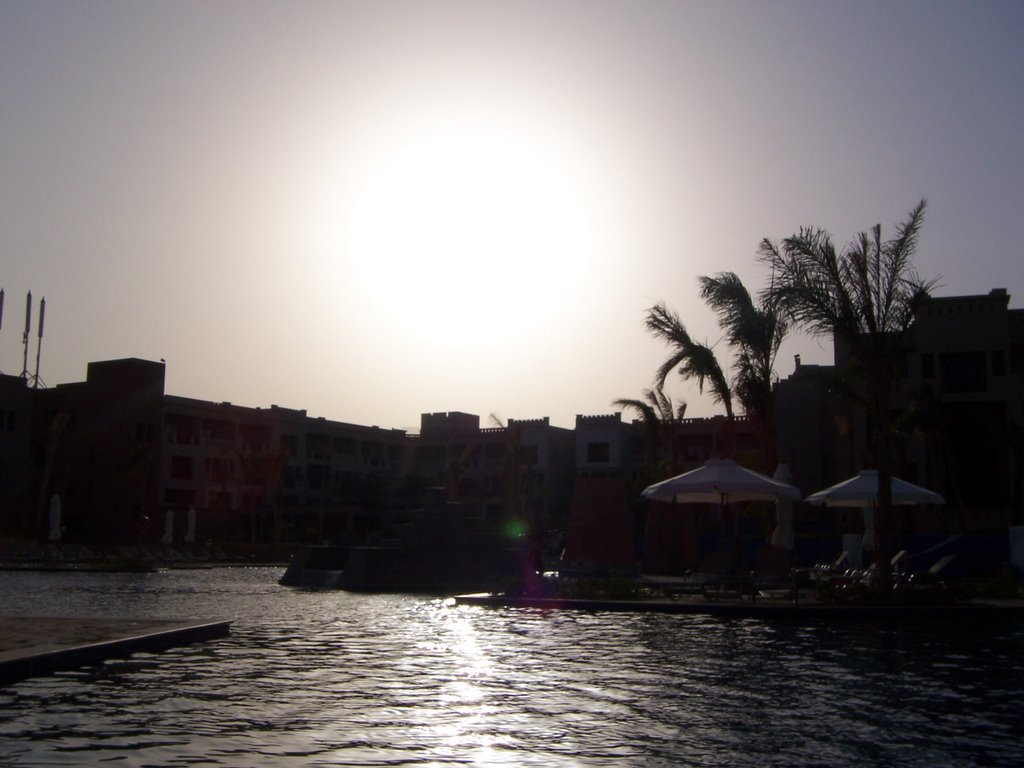 Swimming pool at sunset. Porto Ghaleb by Ahmed Ayoub