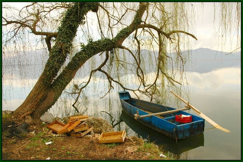 Kastoria Lake - A boat by Thodoris Kliafas