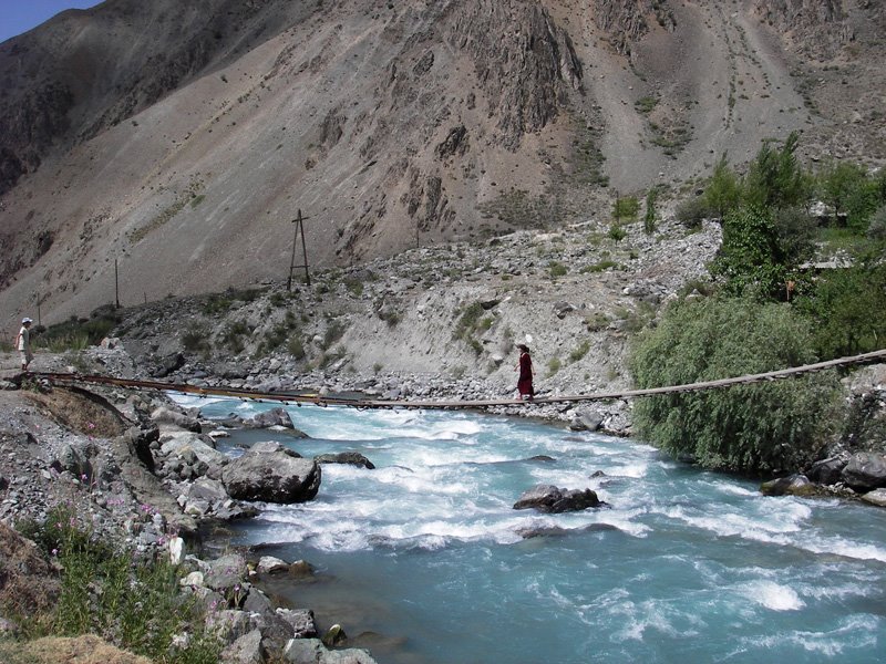 The bridge over Obihumbou river to Deu village. by Adrov Yuri