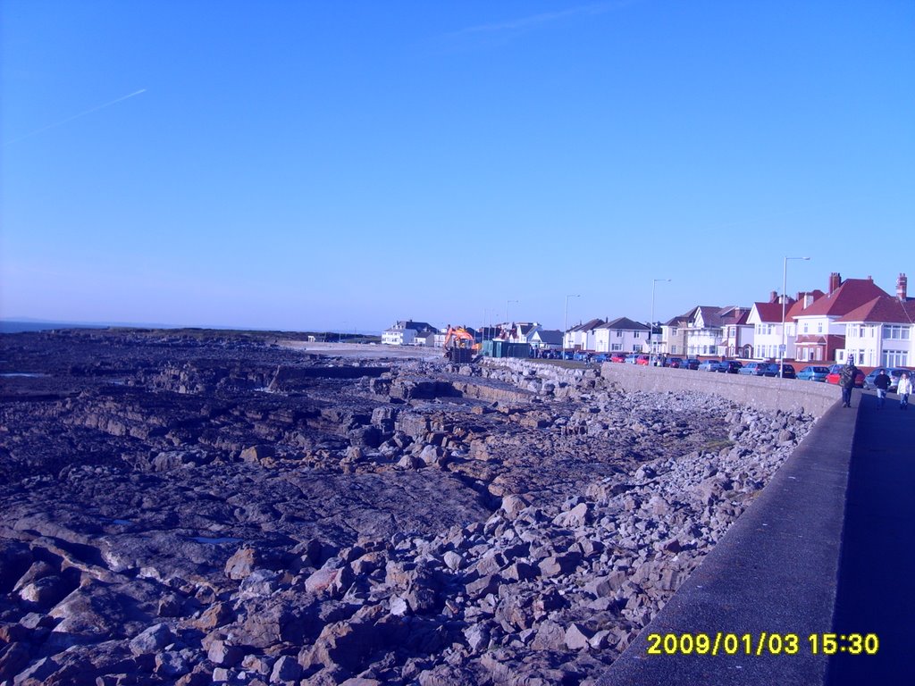 Porthcawl seafront with Port Talbot and Swansea in the far background. Spot Kilvey hill in the background if you can, I bet you can't. by Rory Thudgutter