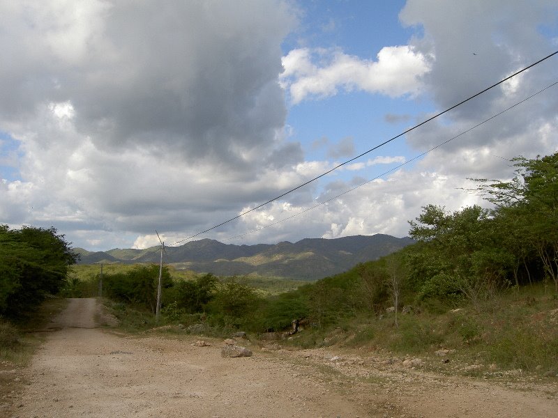 Looking inland towards Sierra Maestra mountains by Chris Ellingsen