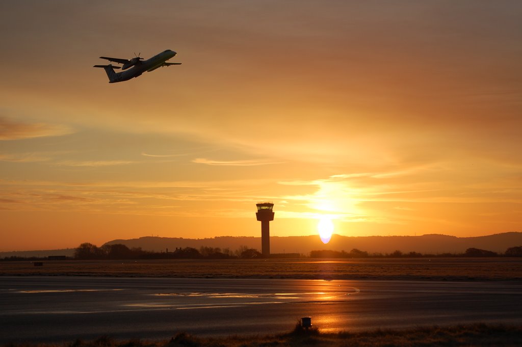 Dash 8 at sunrise by markkil