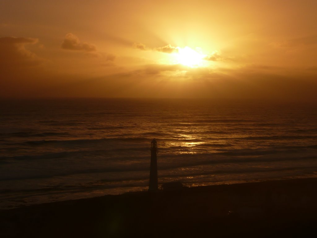 Sunset over Kommetjie Lighthouse by Rob Ceccarelli