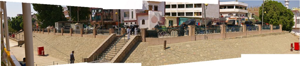 Nile At Edfu Looking At Dock With Hantoors (Carriages) by John Calabria