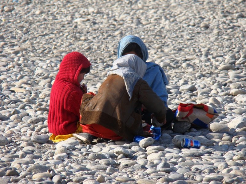 Poor childeren Beside of Golbahar River by Masoud Akbari