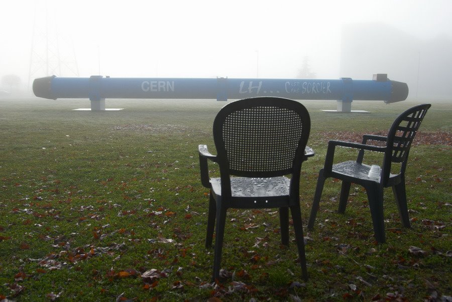 Large Hadron collider monument. Fog around CERN by Yury Gavrikov