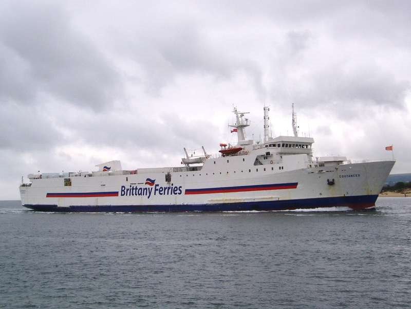 Freight ferry entering Poole harbour by downhill