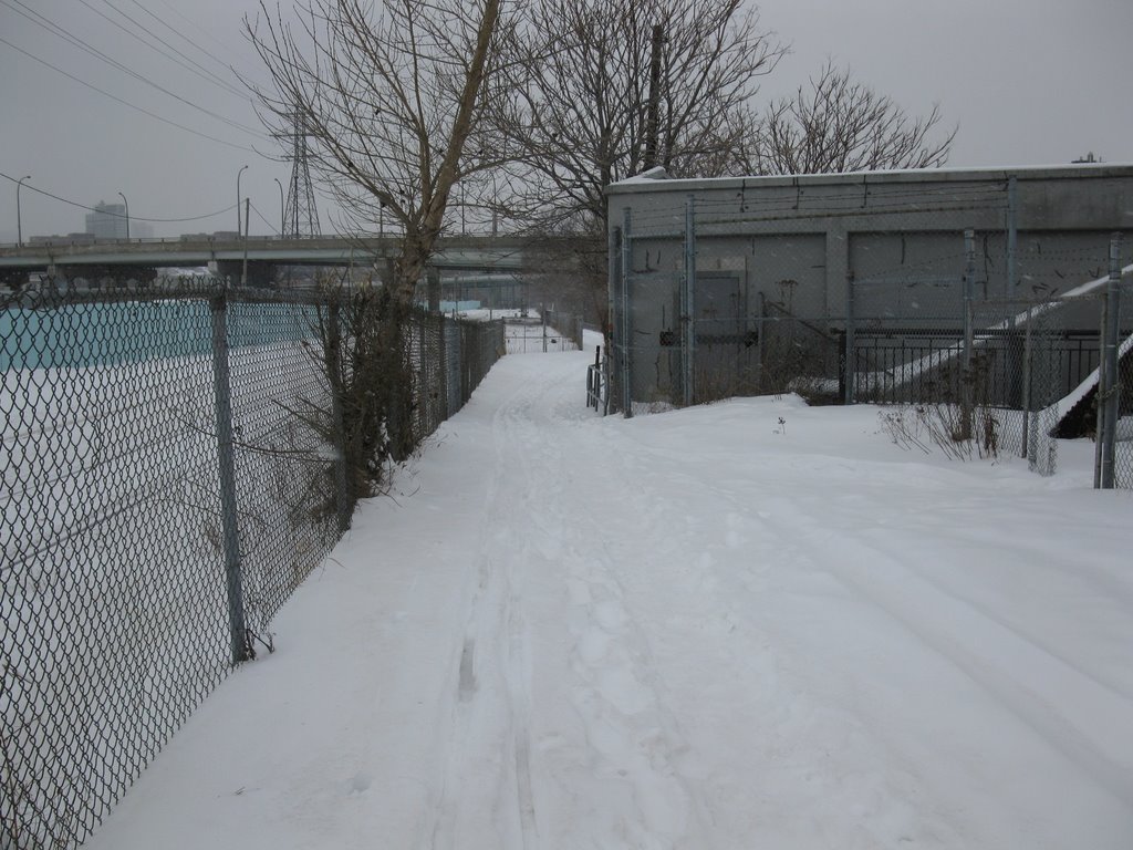 Path squeezed between the train tracks and a closed bridge over the Don River by amorgan