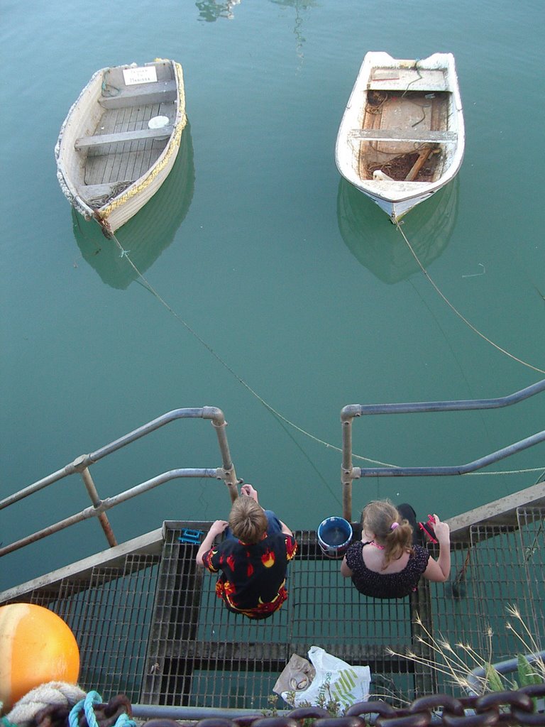 Two by two (Hand fishing in Folkestone Harbour) by Badgerbait