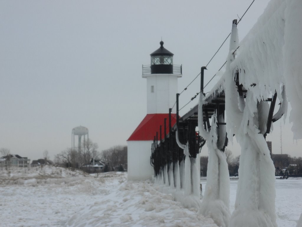 Frozen St. Joseph North Pier Inner Lighthouse and the City Water Tower by UnagiUnagi