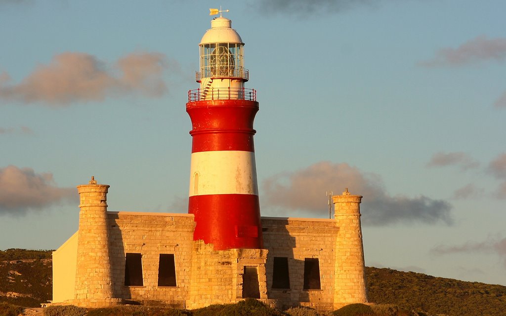 Sunset Lighthouse - Most Southern Point in Africa by Hendrik van den Berg