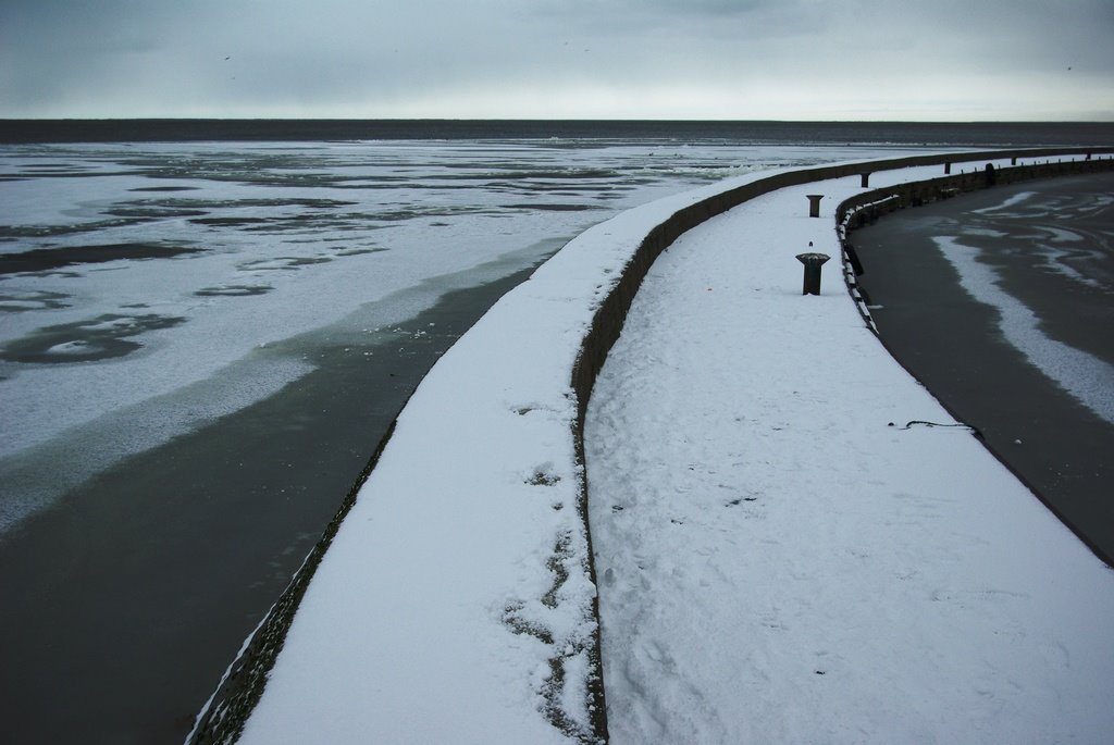 Pier in winter by Antanas Kairys