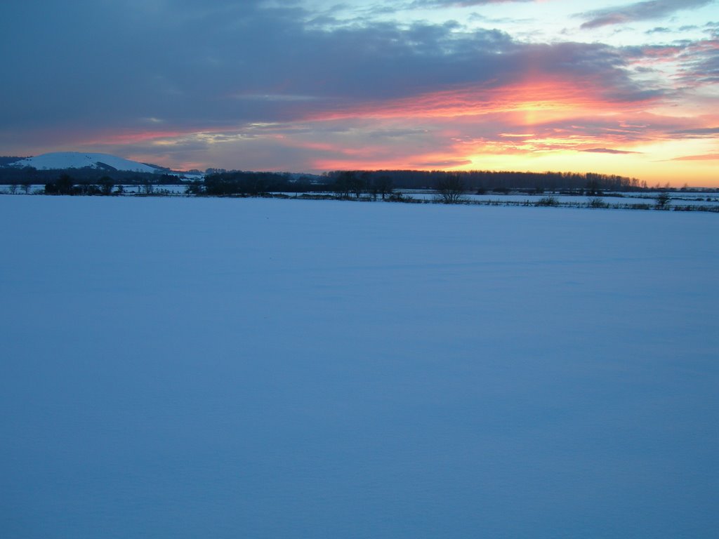 Sunset over snow fields by Joos Schoeman