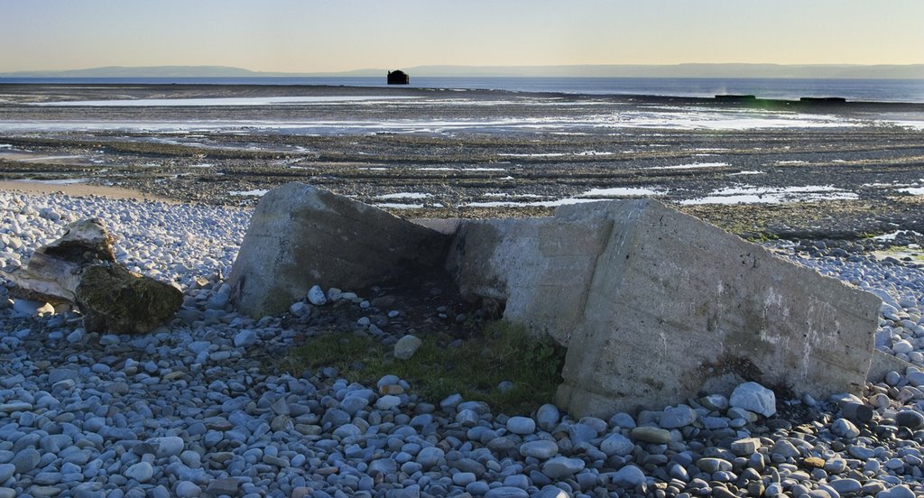 Pillbox slowly sliding down the beach by Guybm