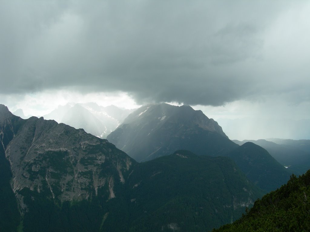 Rain coming over mountain by Dennis van den Heuvel