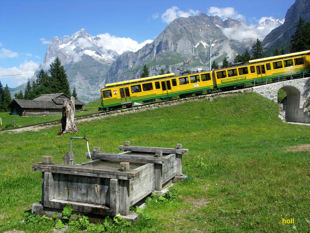 Well in front of the Jungfraubahn and Mount Wetterhorn on the left by holl