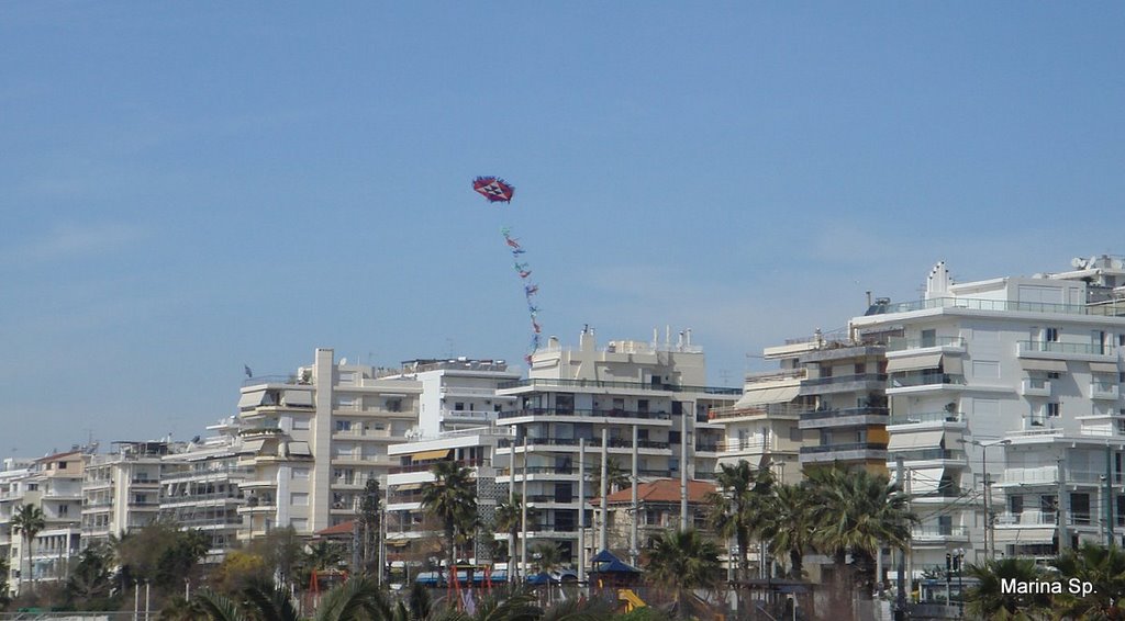 Kite flying above the city- by Marina Sp.