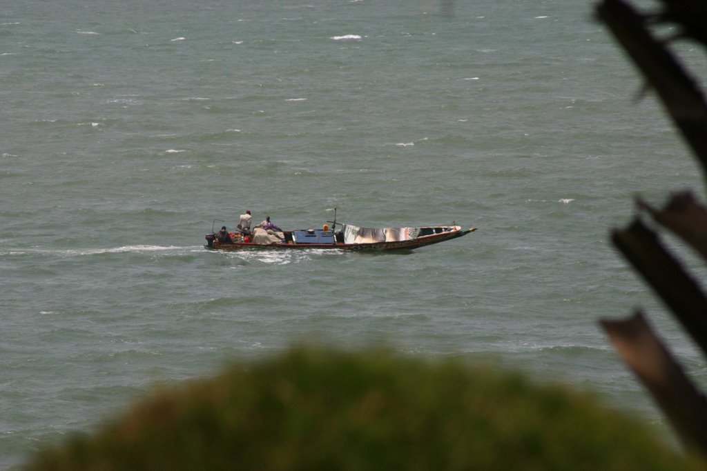 Fishing boat passing Ngala Lodge by John Cowan