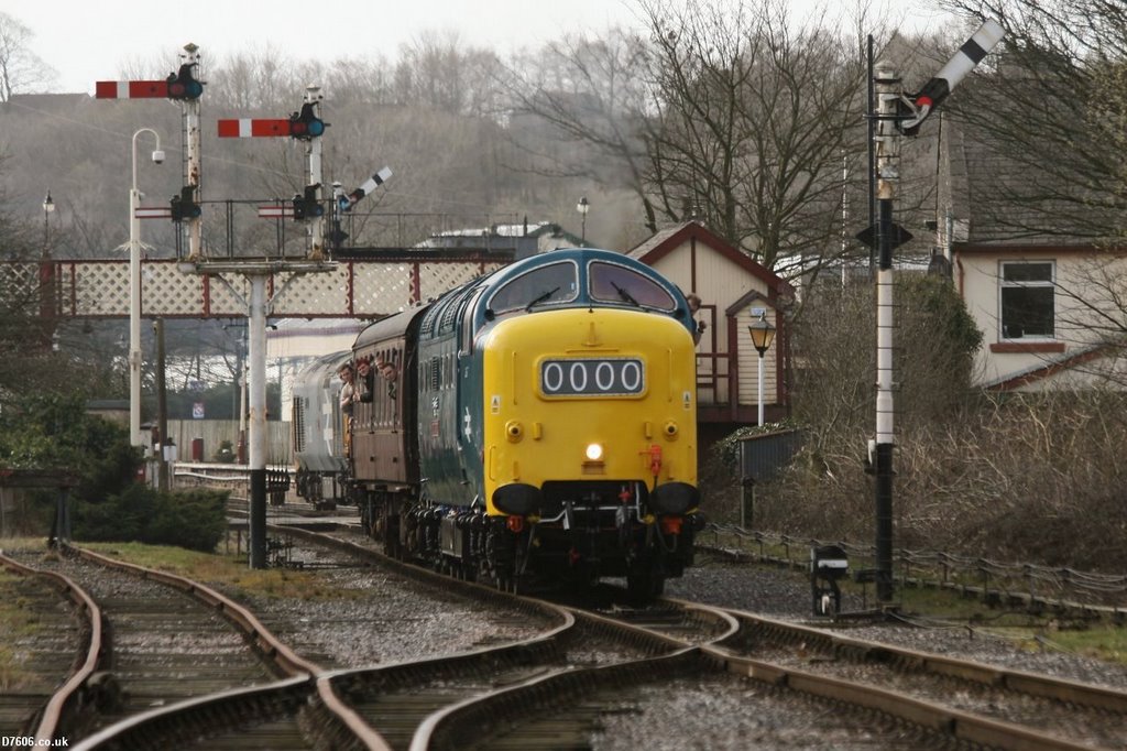 A Deltic locomotive passes Ramsbottom Signal Box by D7606.co.uk