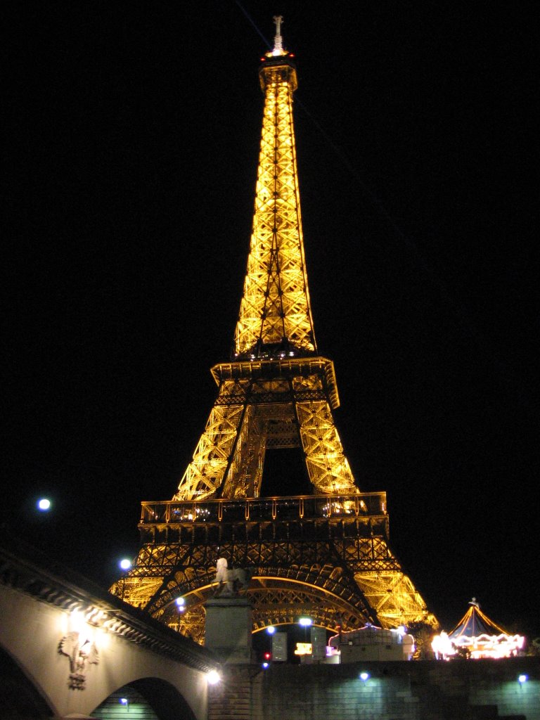 Nightly view of the Tour Eiffel from the Seine by Marco Anastasi