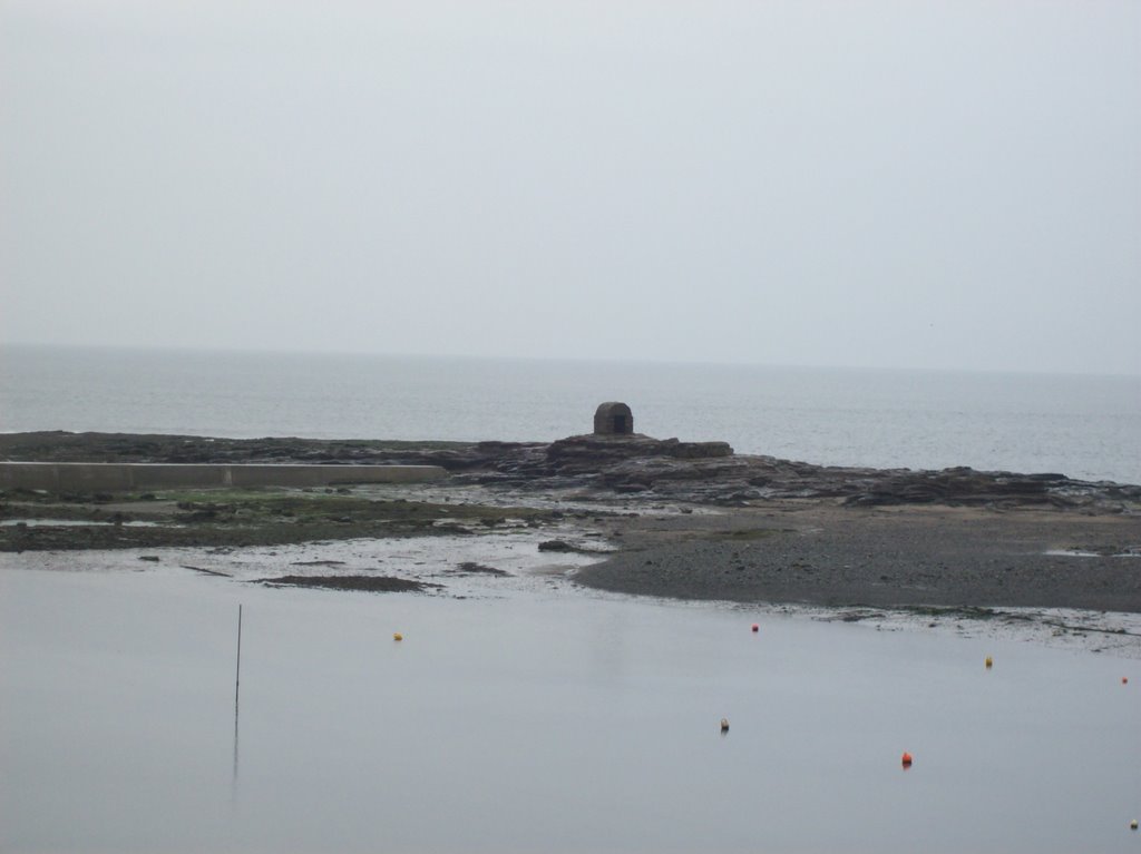 The gunpowder store at seahouses harbour by john wakefield