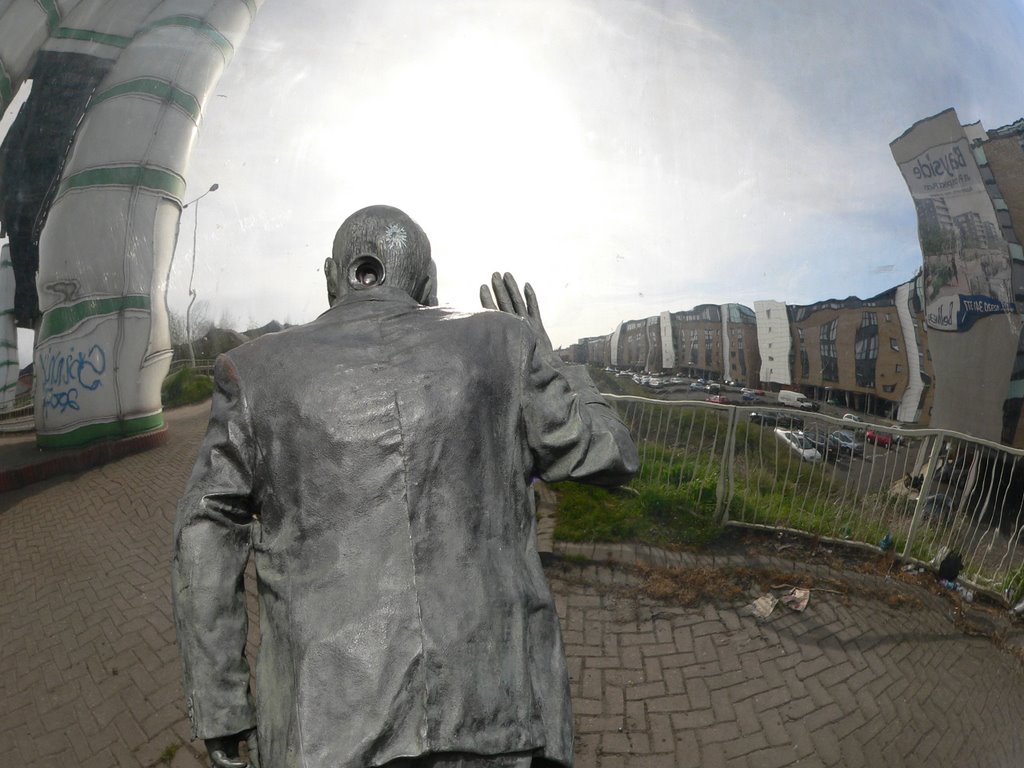 Man Looking Into Giant Ball-bearing by Kelvin Sweet