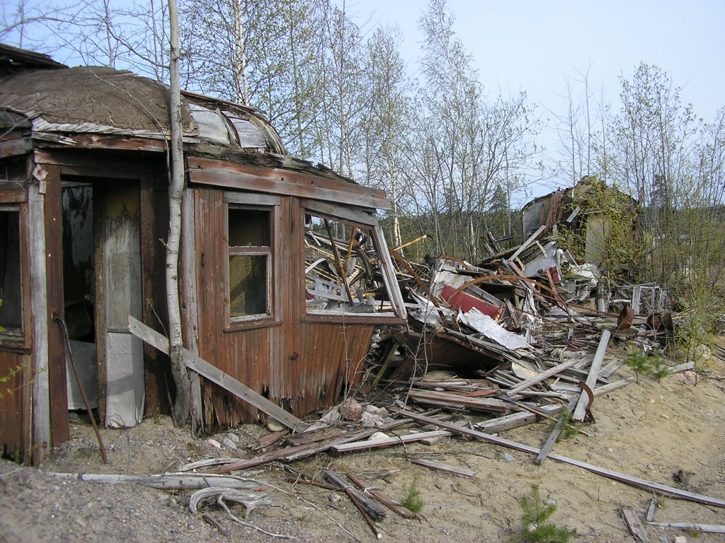 An old, wrecked railway carriage in the middle of a gravel pit [05-2007] by pan-opticon