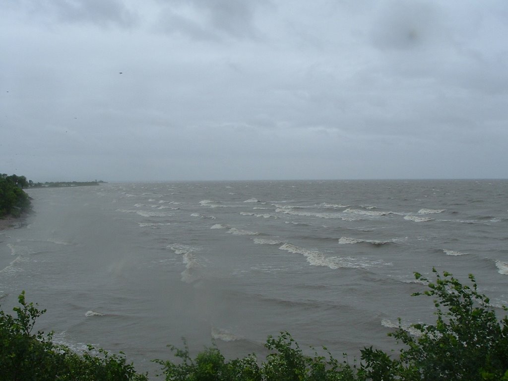 A fine slice of watery hell, Lake Winnipeg Up in gale - 90 -120 km/hr winds. Note Squaw beach and Grand Marais Island in distance. 2008 Jy by Edward Wilson