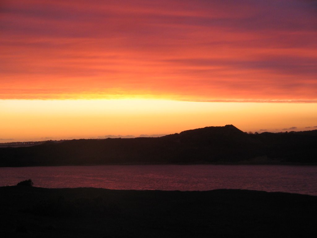 Over lookig Ogmore-by-Sea beach as the sun drops and you get a fab red sky by cowbridgeguide.co.uk