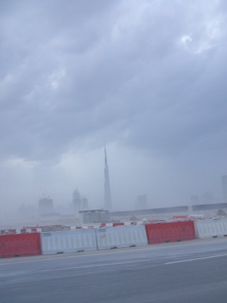 Burj Dubai in a sand storm by onehugaday