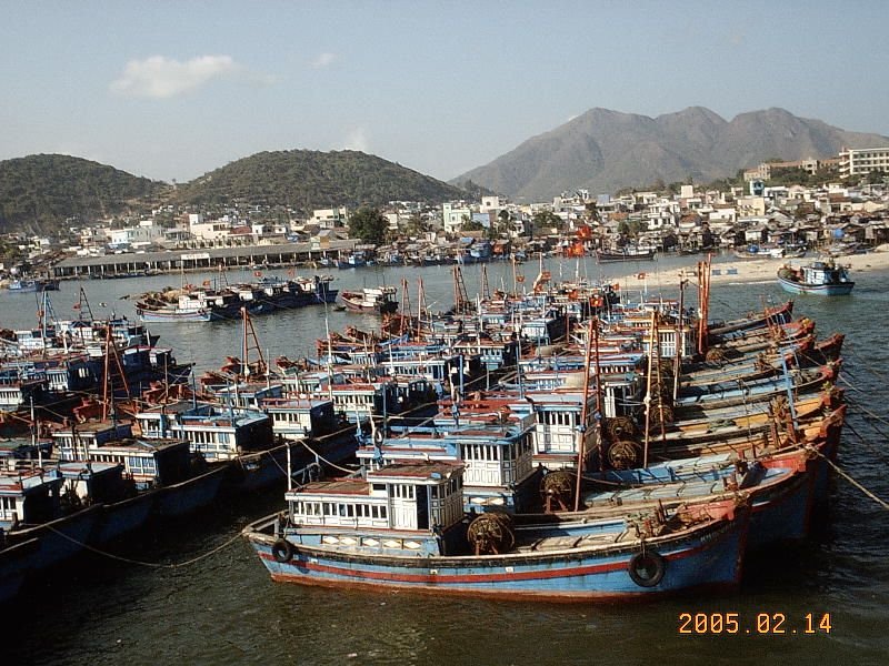 Fishing boats in Nha Trang harbour by Phill Hadikin