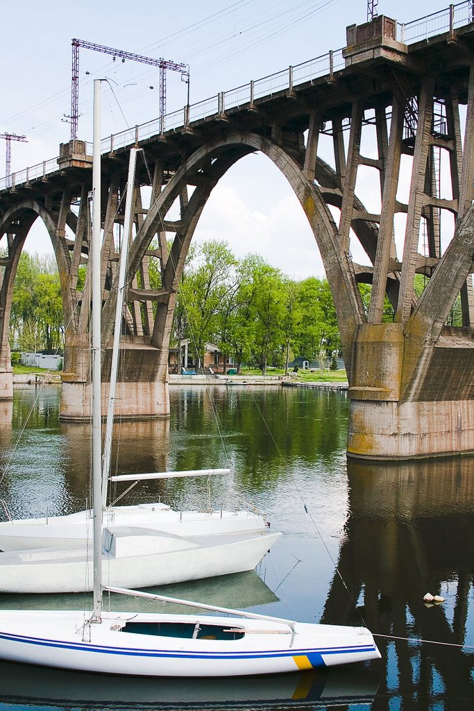 Railway bridge and boats by Anna Seradskaya